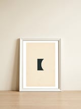 Cut black shape on beige — framed, leaning against the wall thumbnail