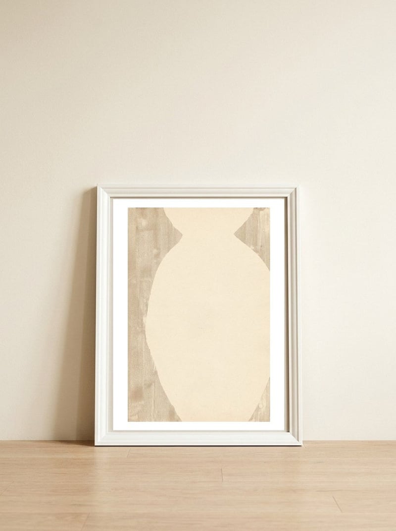 Creame tone vase silhouette — framed, leaning against the wall