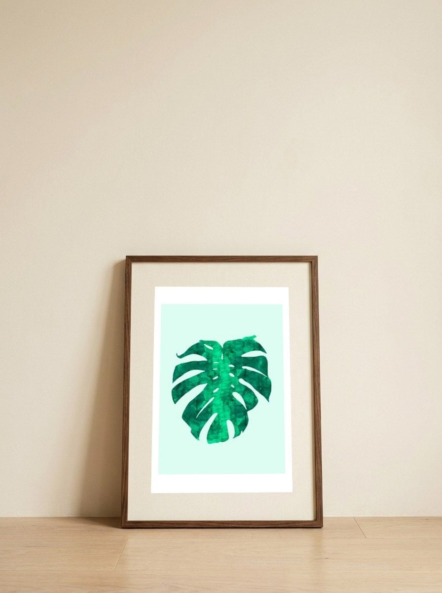Watercolor Tropical Leaf II — framed, leaning against the wall