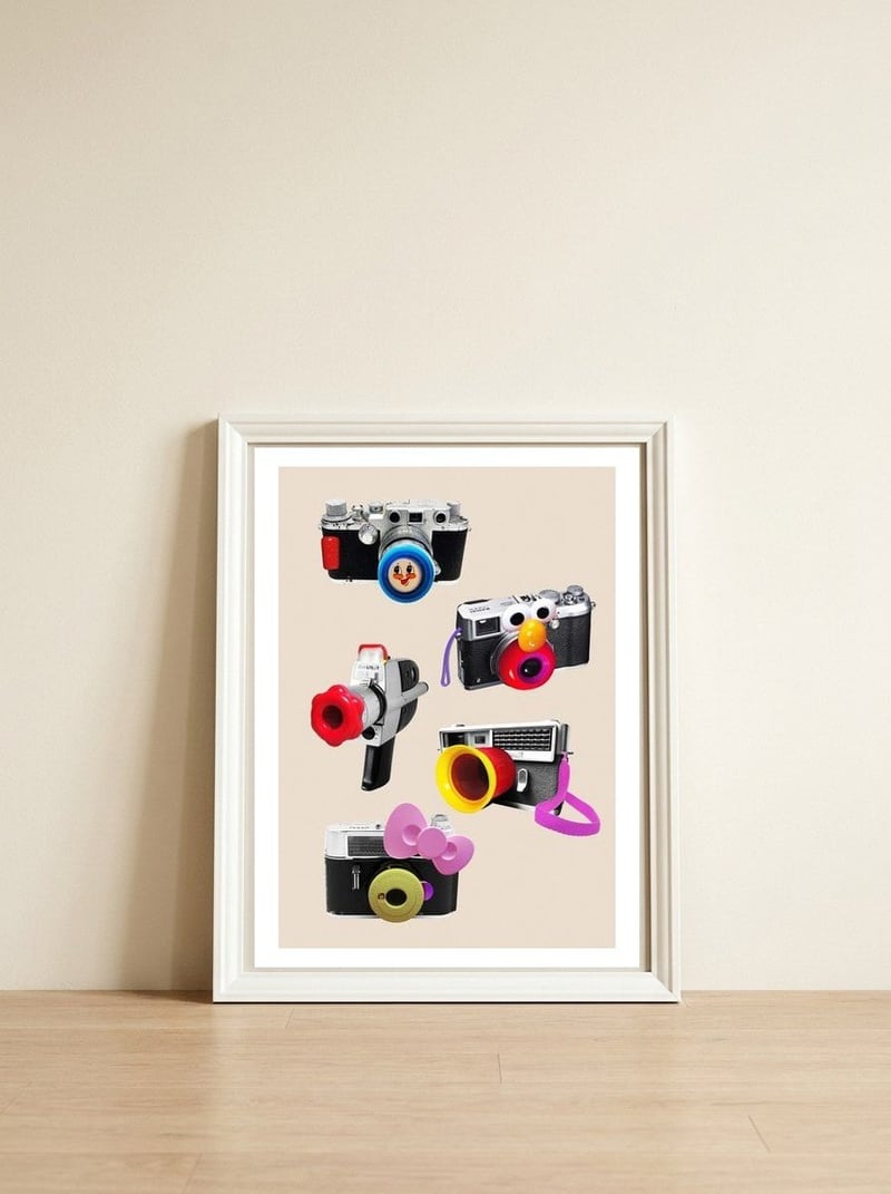 Toy Cameras — framed, leaning against the wall