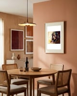 powerful-tribal-warrior-woman-side-gaze framed in a intimate room thumbnail