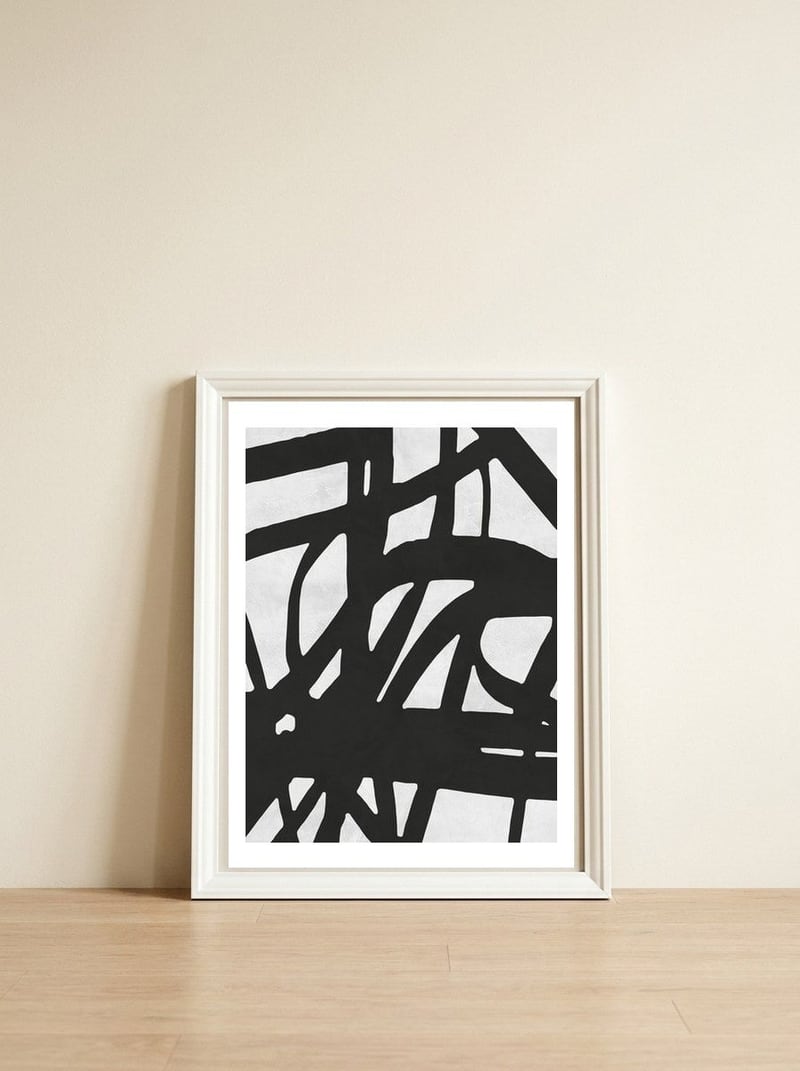 Expressionist black and white V — framed, leaning against the wall