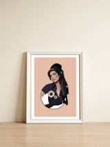 Amy Winehouse — framed, leaning against the wall thumbnail