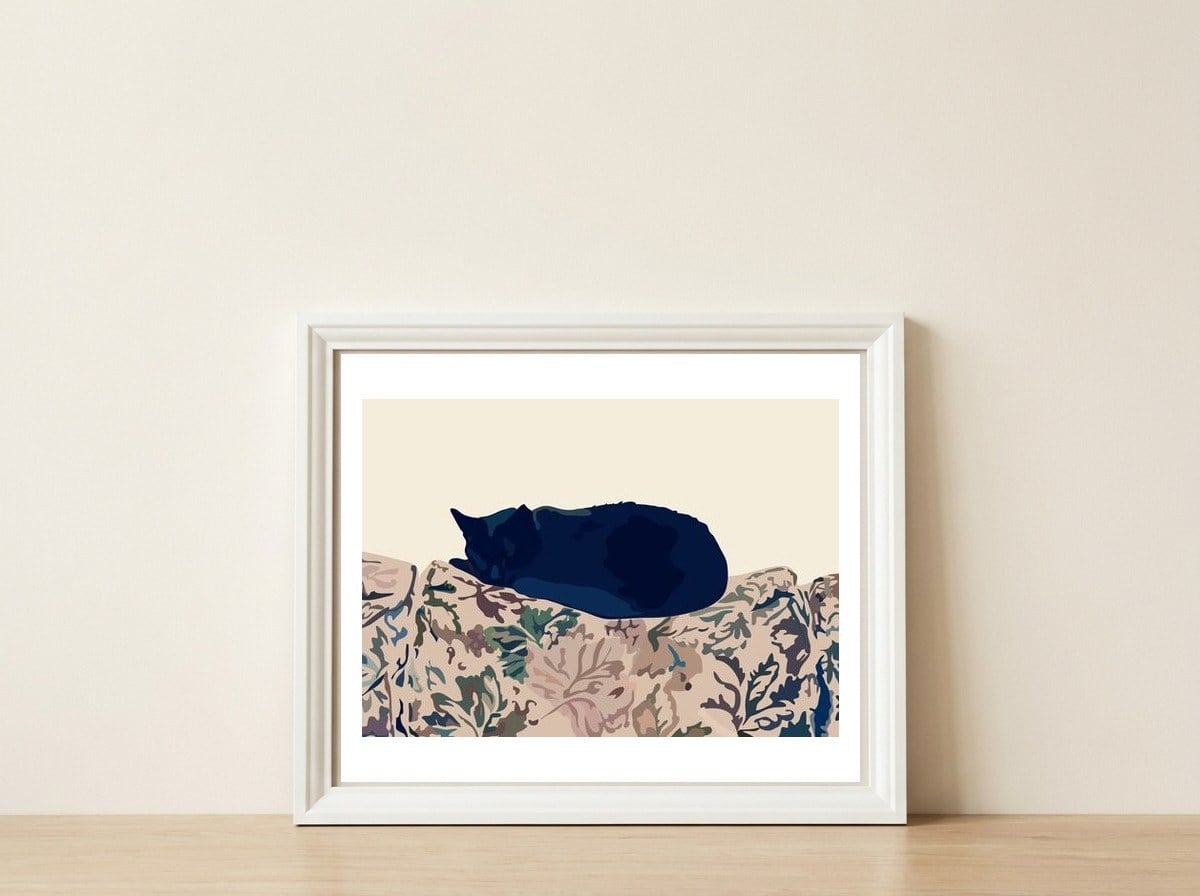 Kitty — framed, leaning against the wall