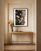 Pink flowers in the shadow framed in a welcoming room thumbnail