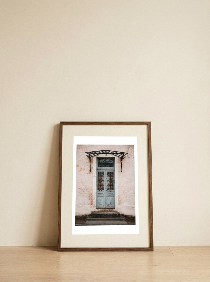 Vintage blue door — framed, leaning against the wall