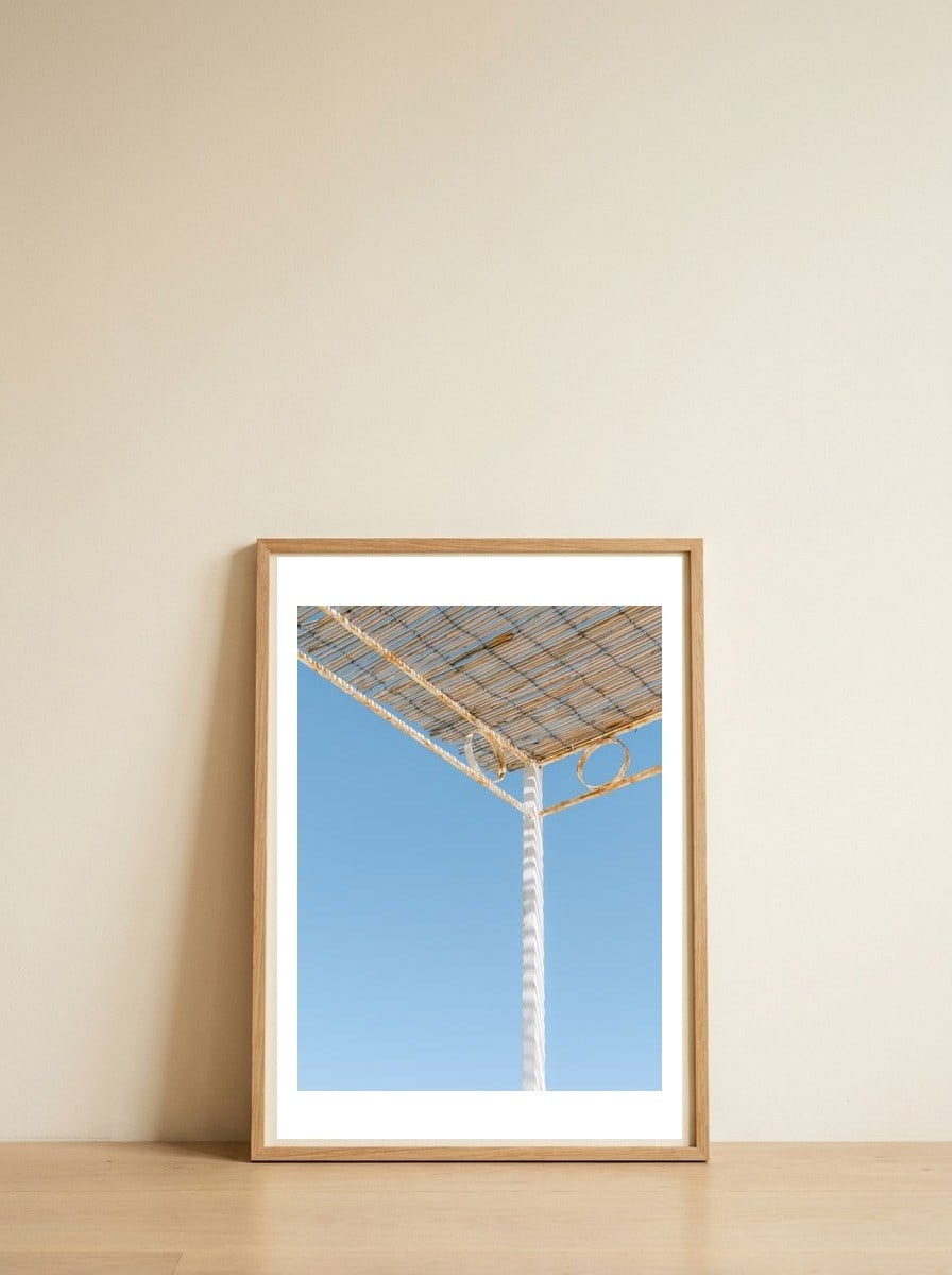 Hiding from the sun — framed, leaning against the wall