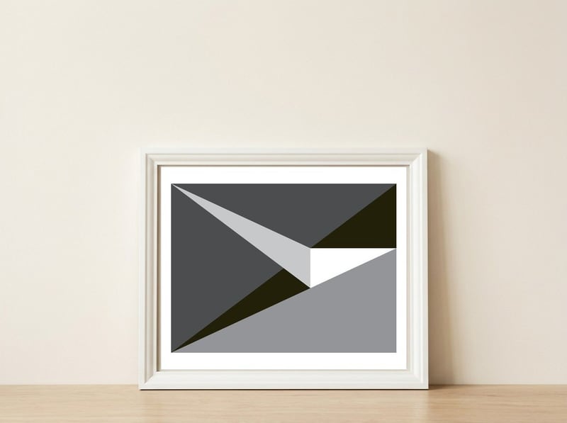 Geometric Shapes No. 73 - black & grey triangles  — framed, leaning against the wall