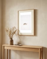 Reindeer in the snow framed in a welcoming room thumbnail