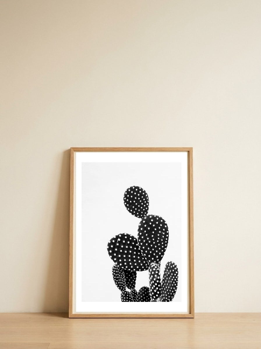 cactus vertical — framed, leaning against the wall
