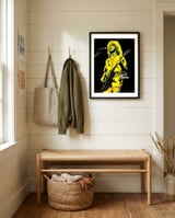peter-frampton-rock-music-guitarist-legend framed in a relaxed room thumbnail