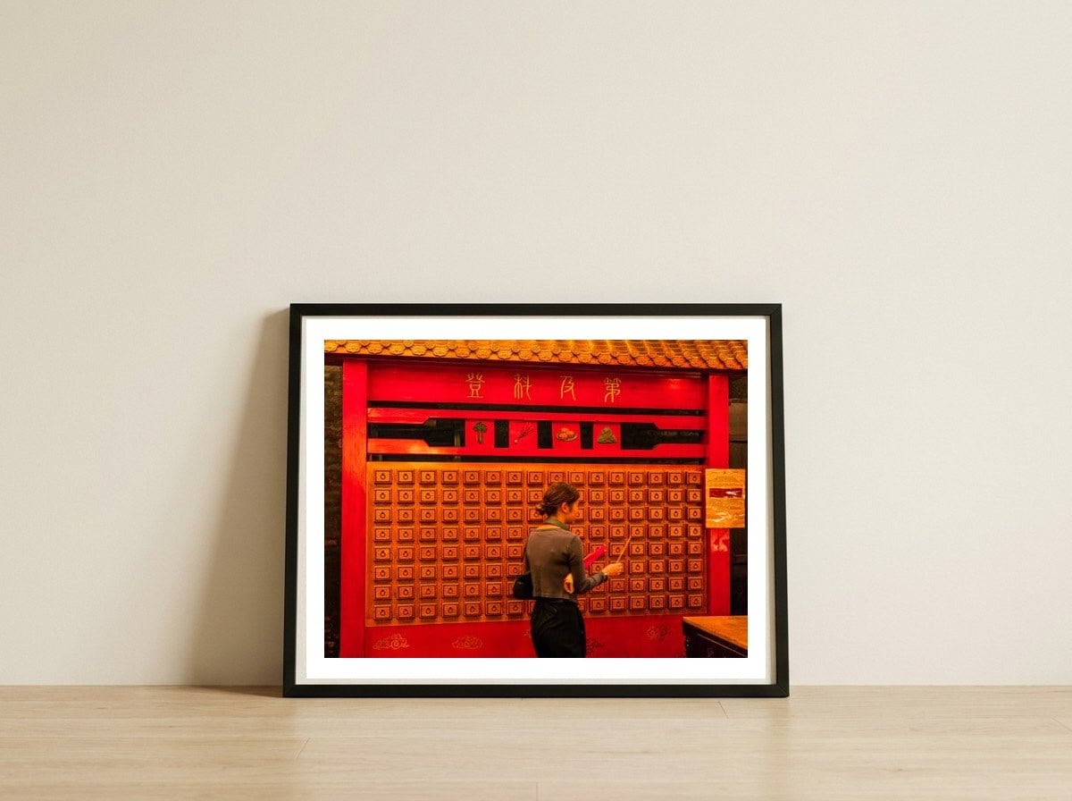 red-3 — framed, leaning against the wall