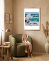 Dynamic Crashing Turquoise Ocean Wave Against Rugged Coastal Rocks framed in a tender room thumbnail