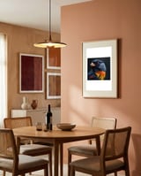 black-bird-with-red-eyes-and-orange-chest-feathers-1 framed in a intimate room thumbnail