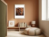 Majestic Lion Resting Among Orange Flowers framed in a gentle room thumbnail