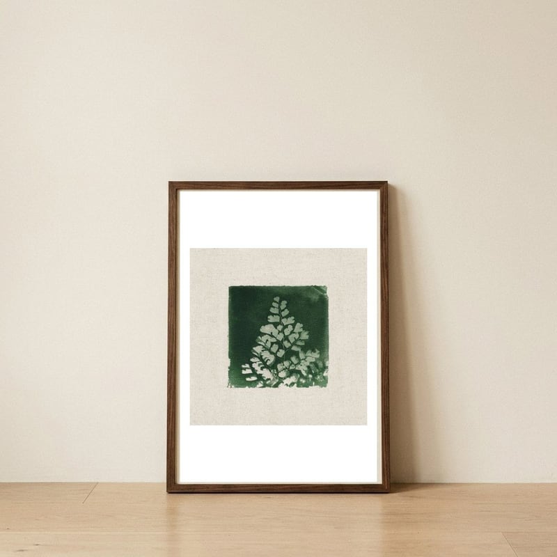 Green Fern Botanical Print — framed, leaning against the wall