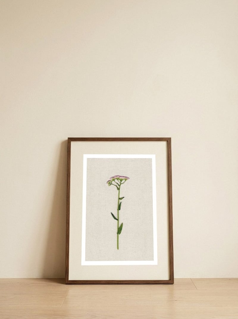 Delicate Pink Wildflower — framed, leaning against the wall