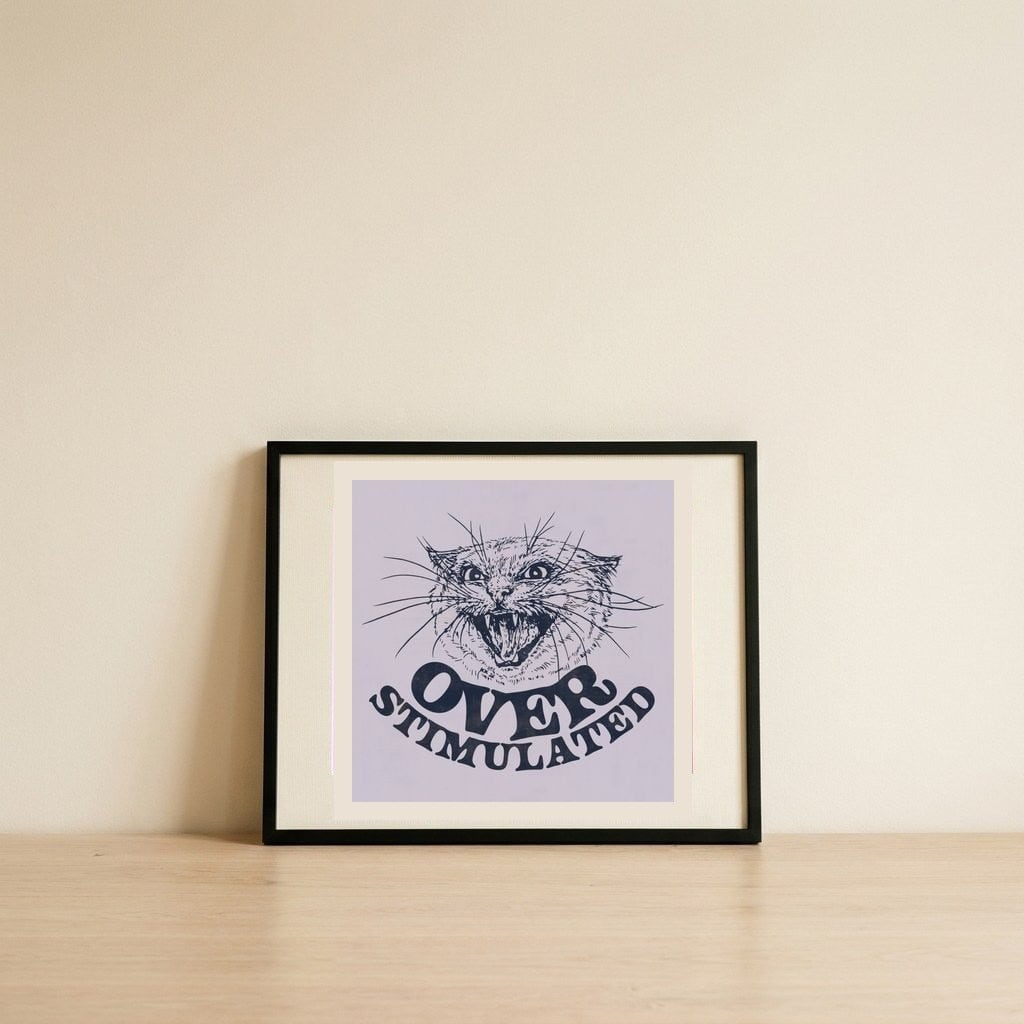 Over Stimulated Cat — framed, leaning against the wall