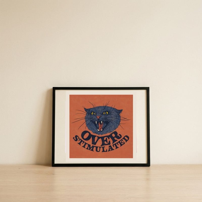 Angry Over Stimulated Cat — framed, leaning against the wall