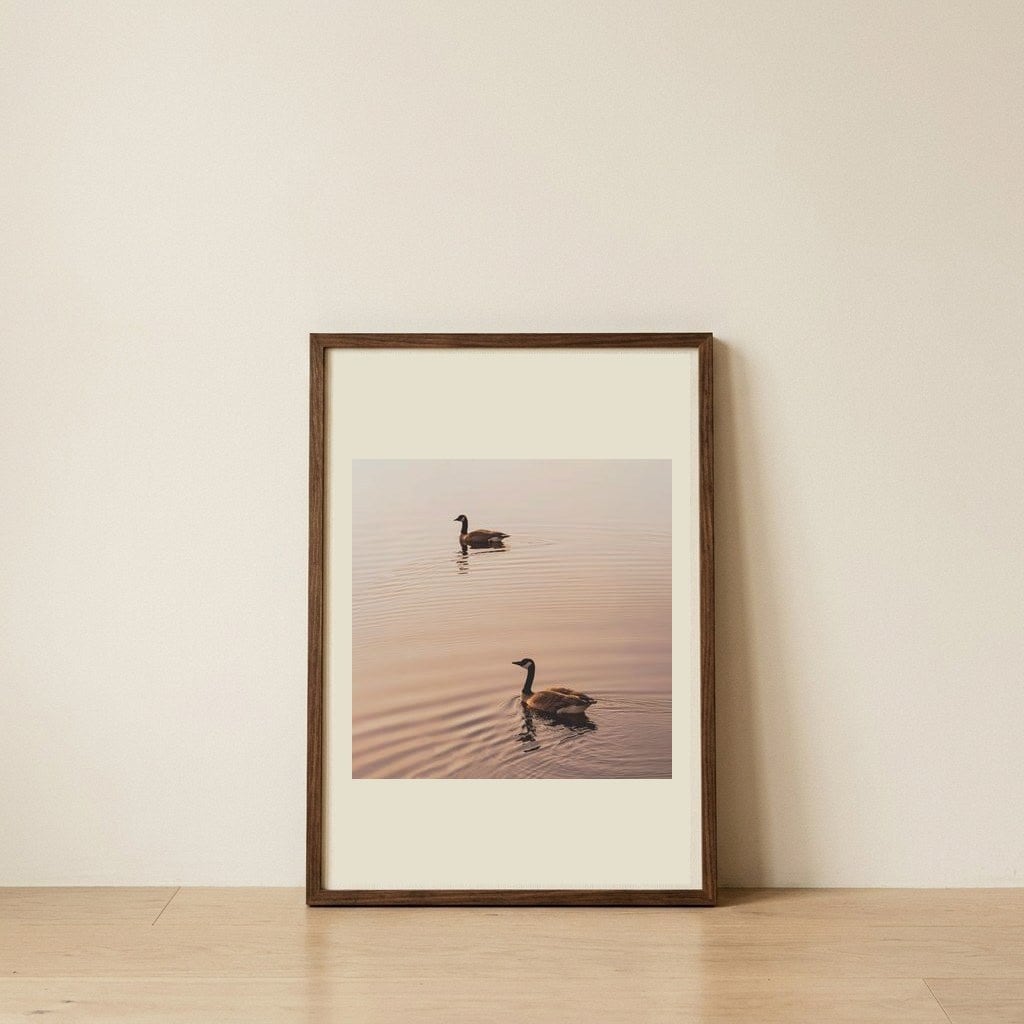 Golden Hour Geese — framed, leaning against the wall