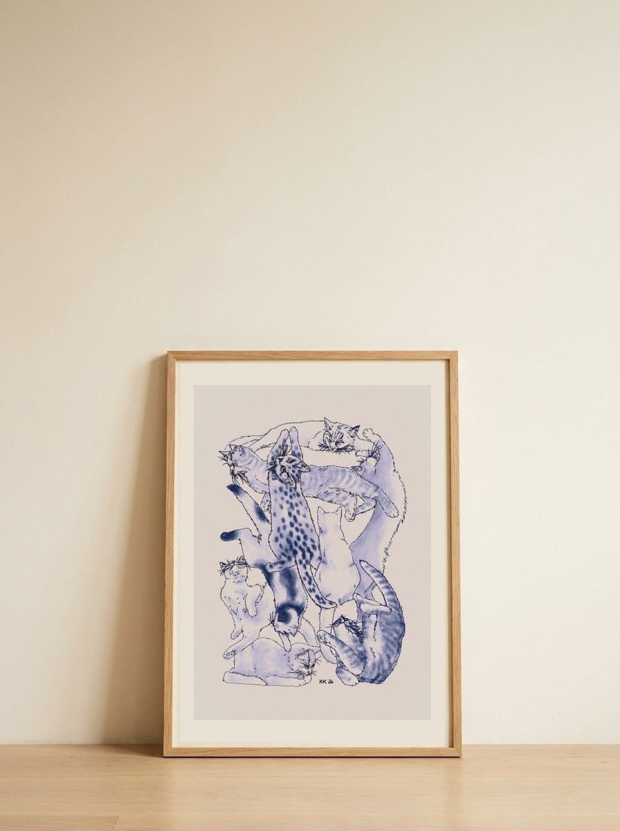 Playful Cat Pile — framed, leaning against the wall