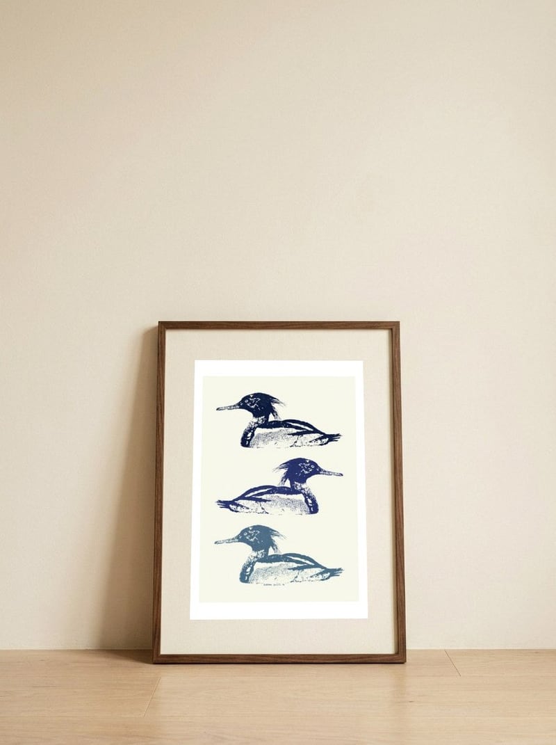 Stacked Blue Mergansers — framed, leaning against the wall