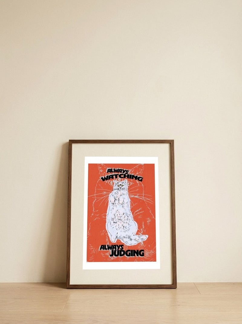 Three-Eyed Judging Cat — framed, leaning against the wall