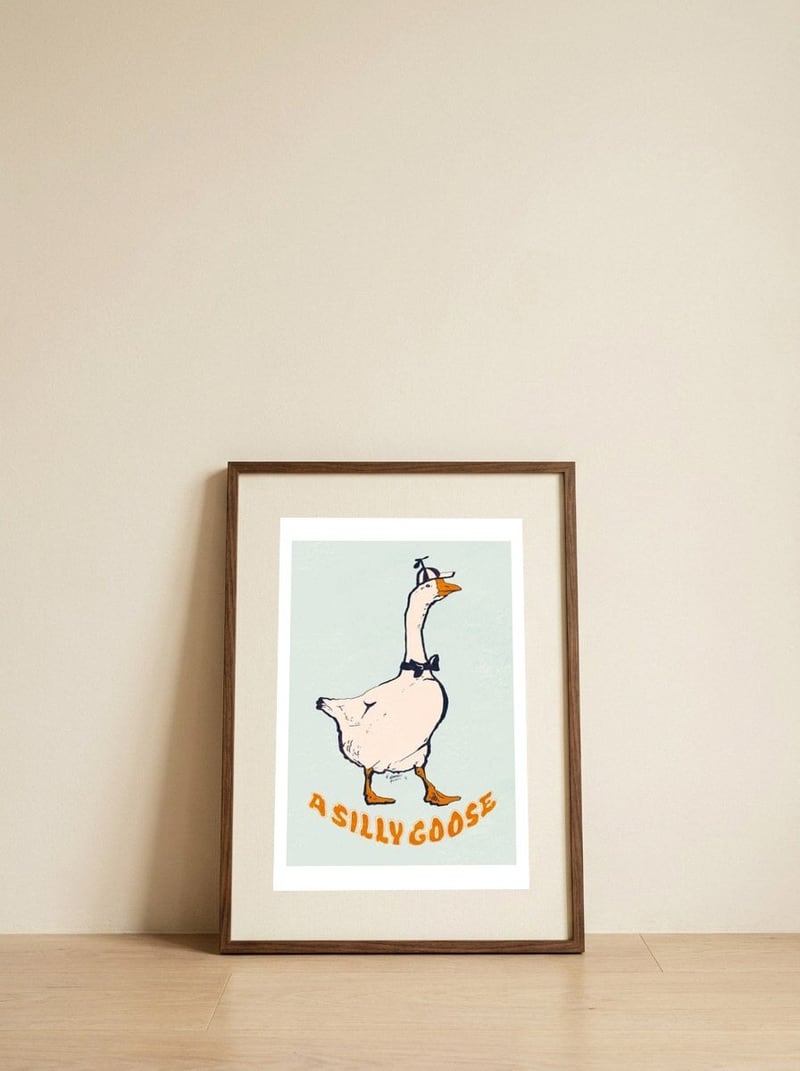 A Silly Goose — framed, leaning against the wall