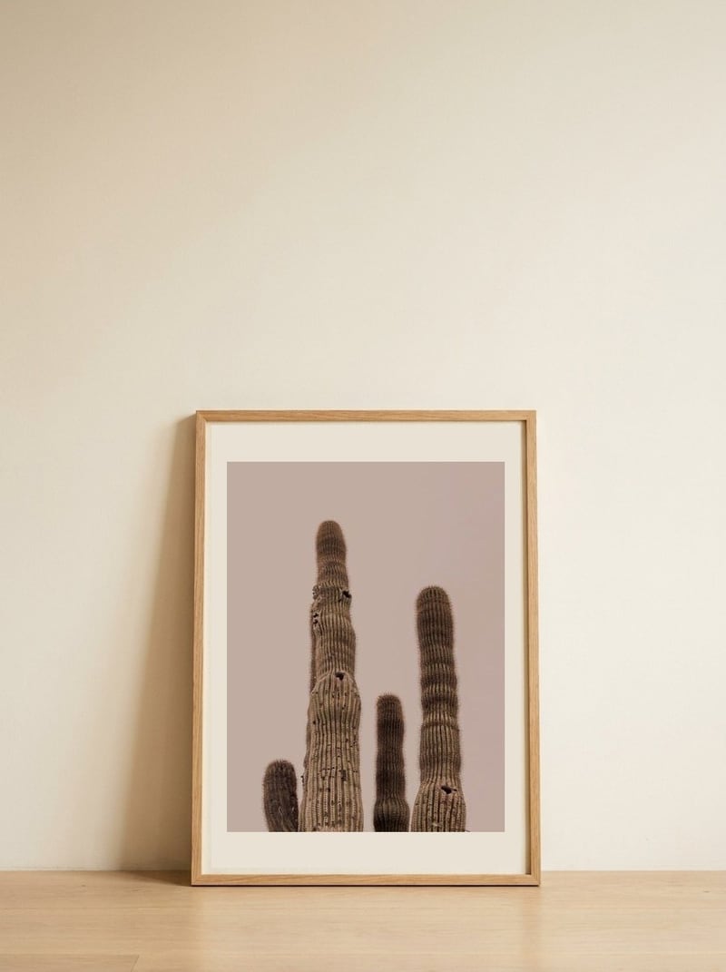 Tall Saguaro Cacti — framed, leaning against the wall