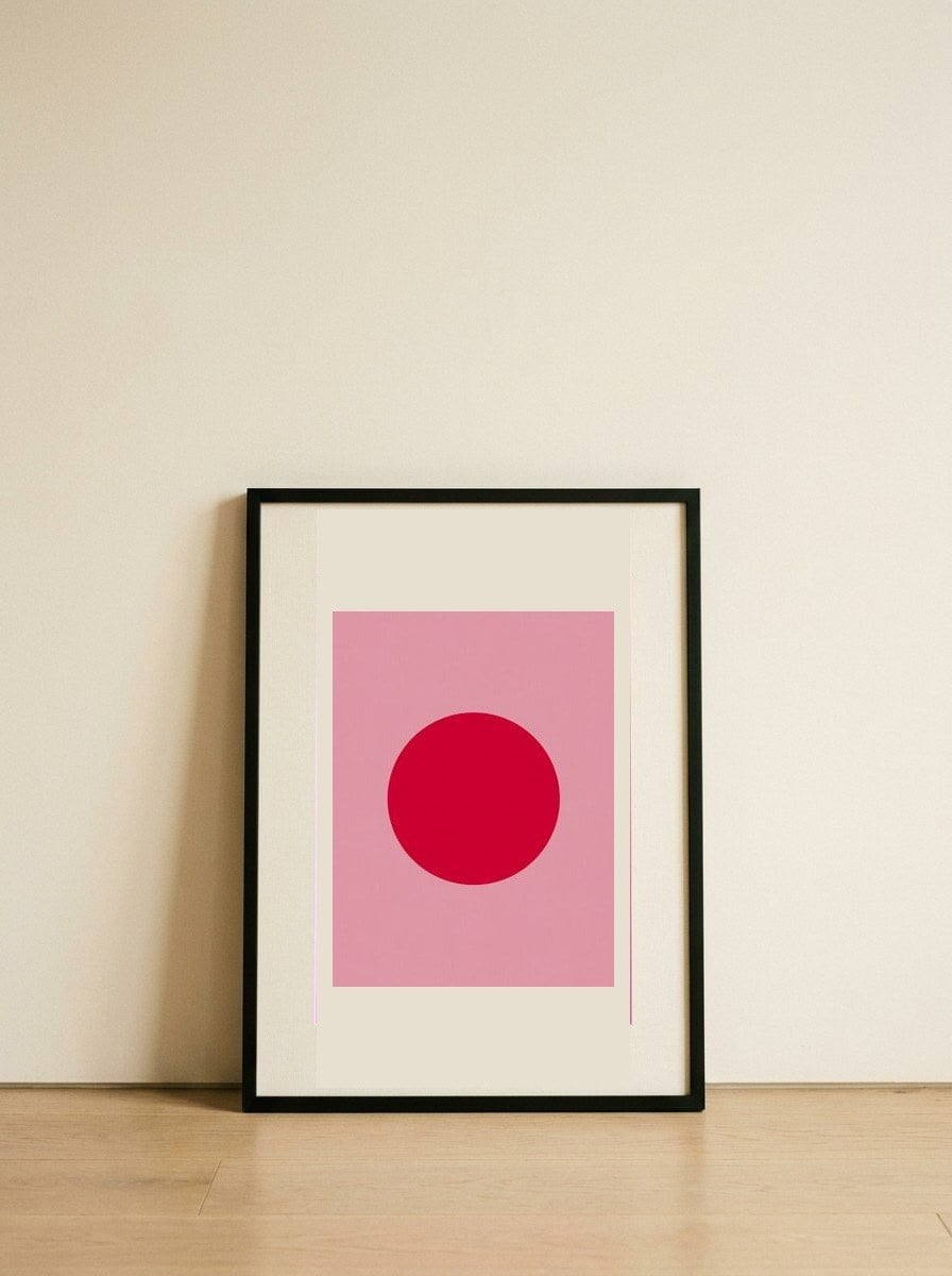 Red Circle on Pink — framed, leaning against the wall