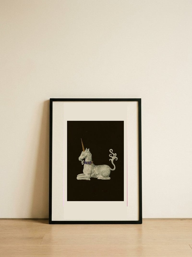 Regal White Unicorn — framed, leaning against the wall