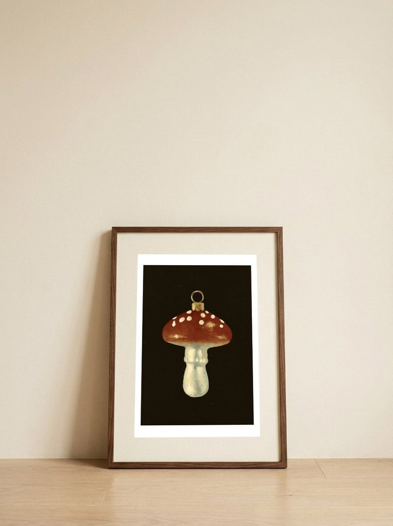 Festive Mushroom Ornament — framed, leaning against the wall
