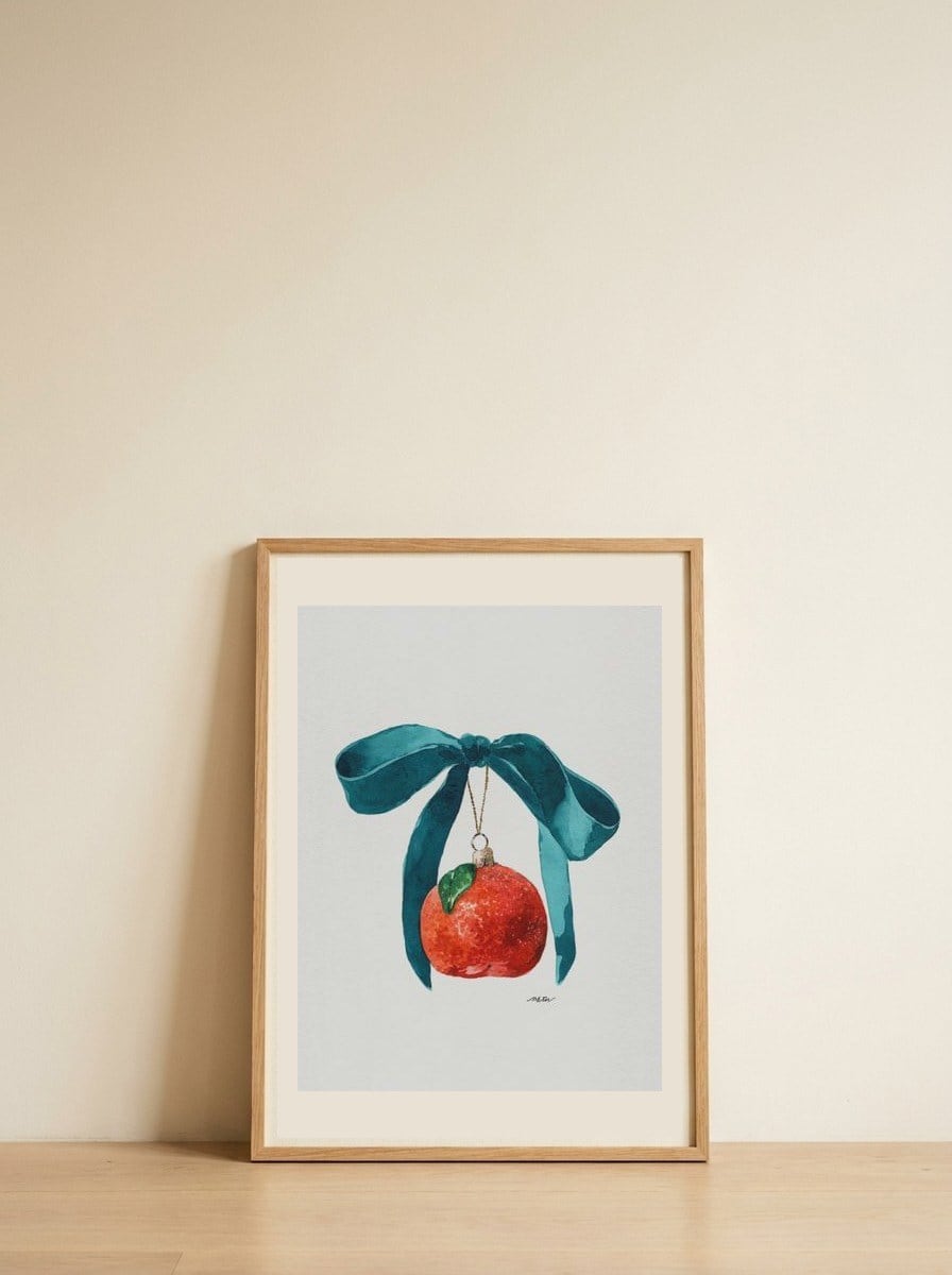 Festive Tangerine Ornament — framed, leaning against the wall