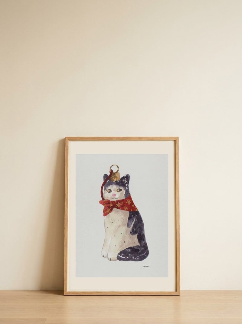 Christmas Cat Ornament — framed, leaning against the wall