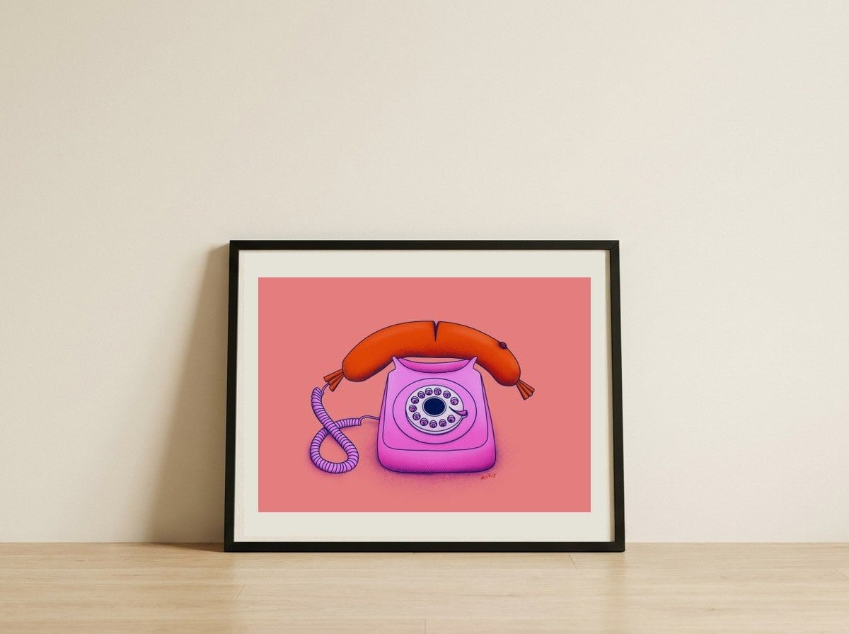 Whimsical Sausage Phone — framed, leaning against the wall