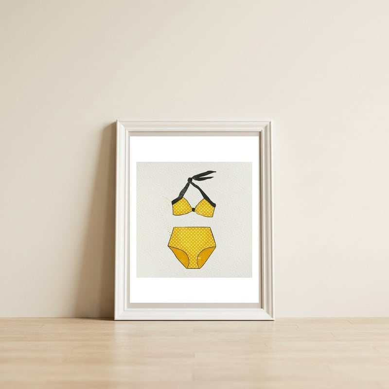 Yellow polka dot bikini — framed, leaning against the wall