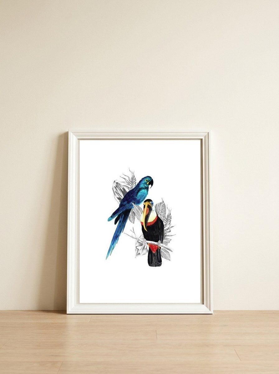 The Toucan and the Parrot — framed, leaning against the wall