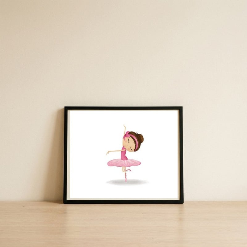 Adorable Twirling Ballerina Nursery Print — framed, leaning against the wall