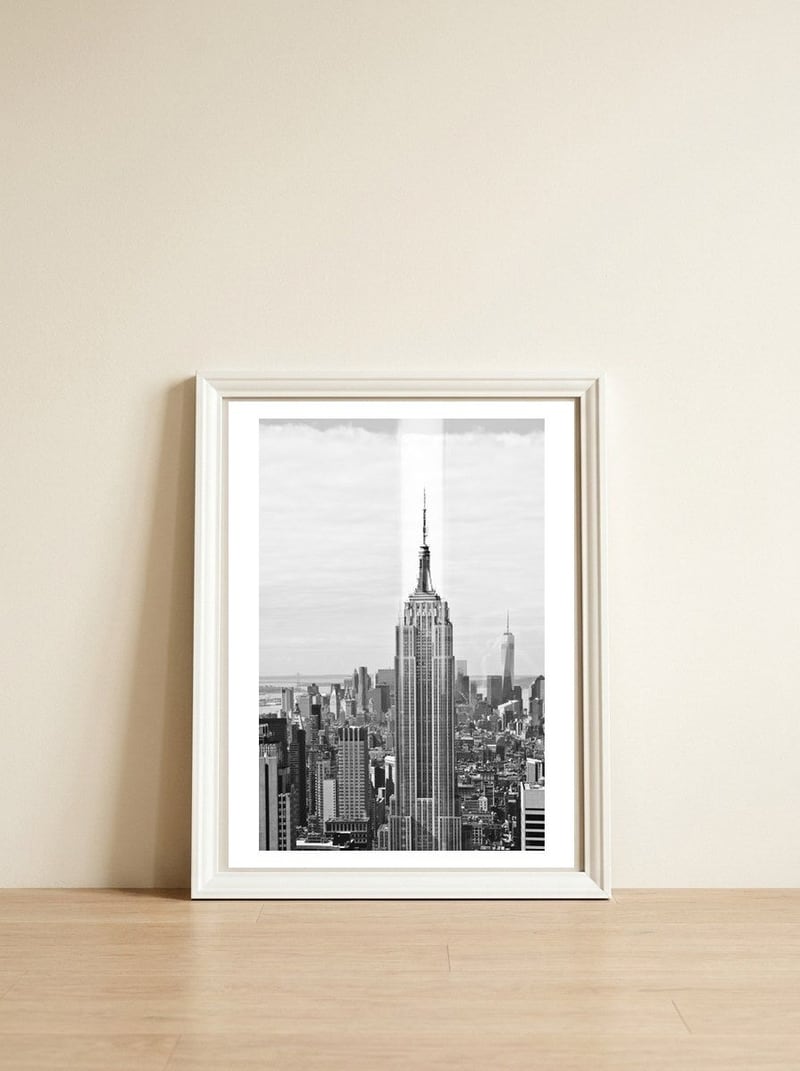 Empire State Building, Reflections in New York — framed, leaning against the wall