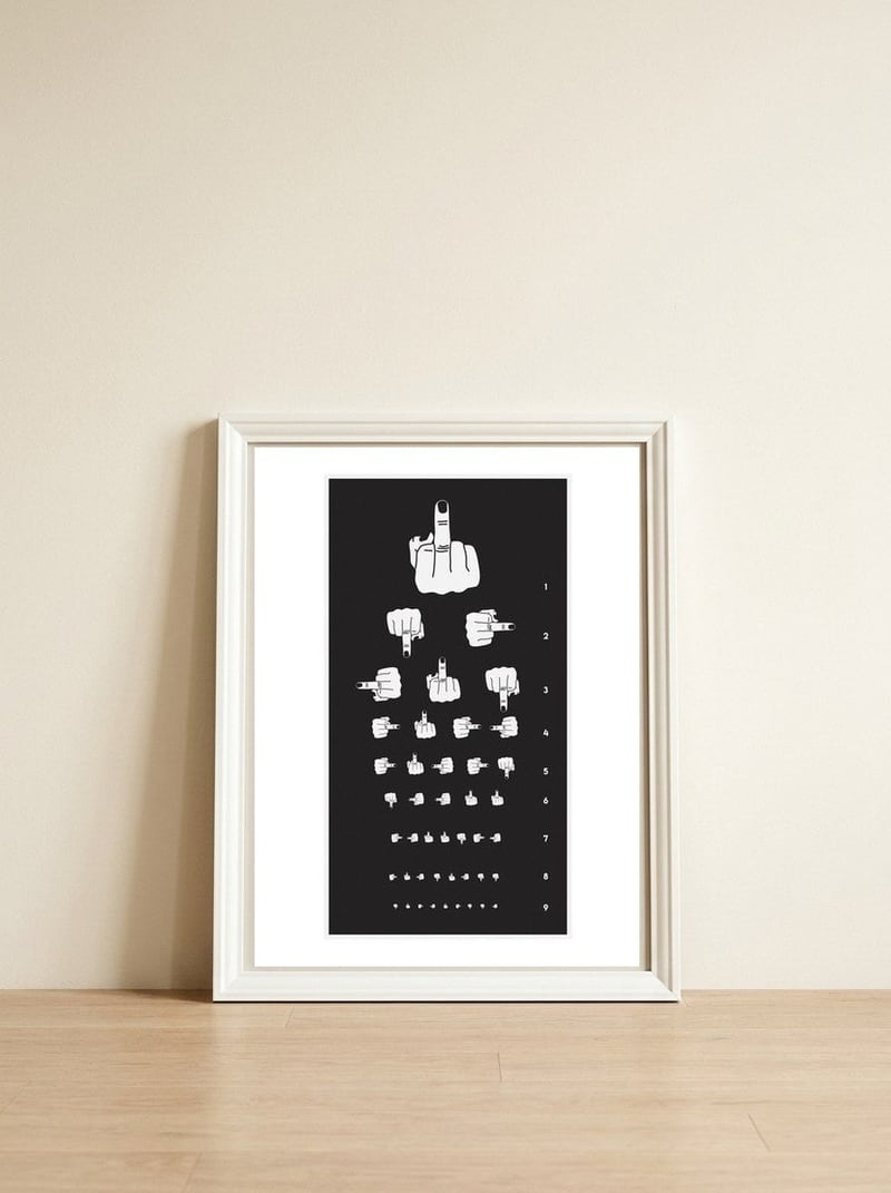 Middle Finger Vision Test — framed, leaning against the wall
