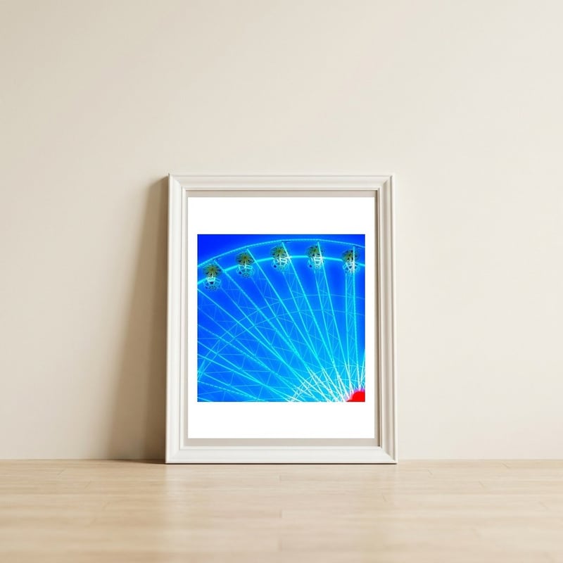 Giant wheel — framed, leaning against the wall