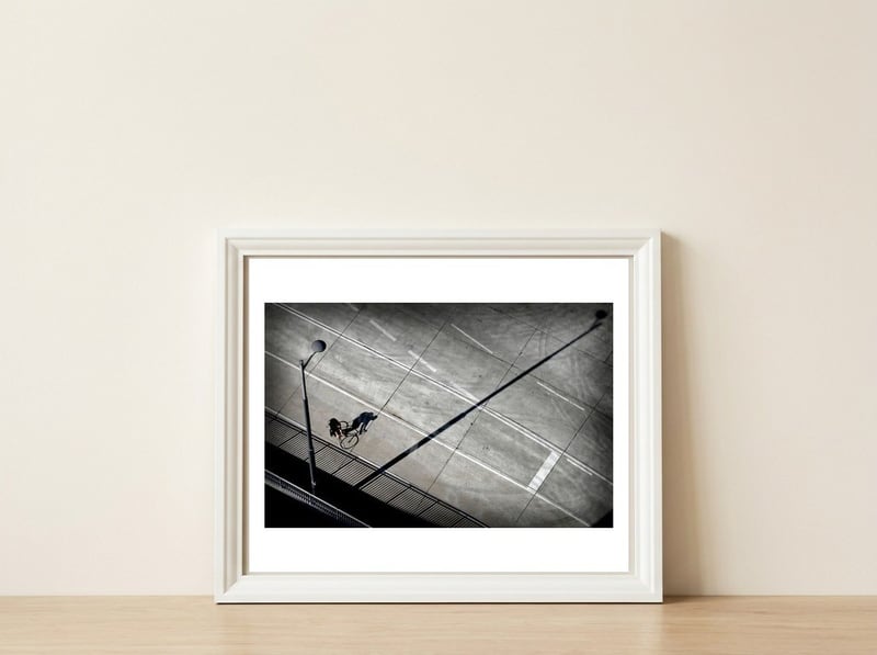 Cyclist — framed, leaning against the wall
