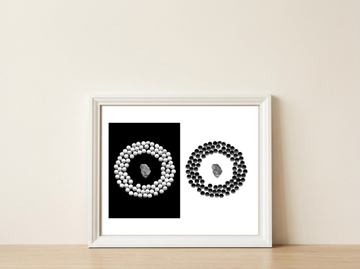 Pearls and stone — framed, leaning against the wall