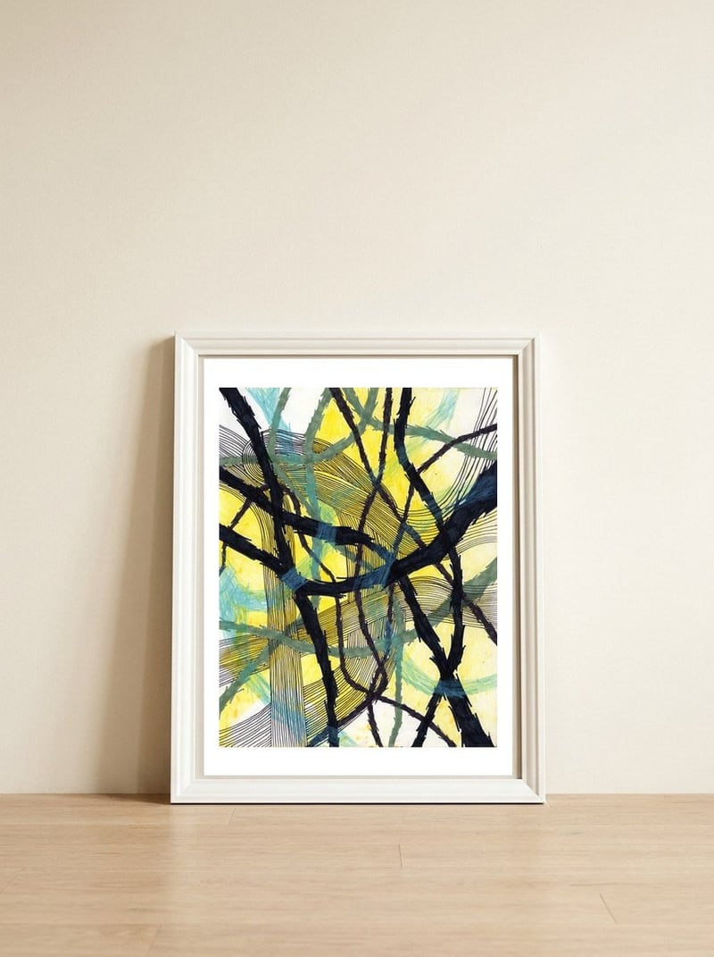Interwoven — framed, leaning against the wall