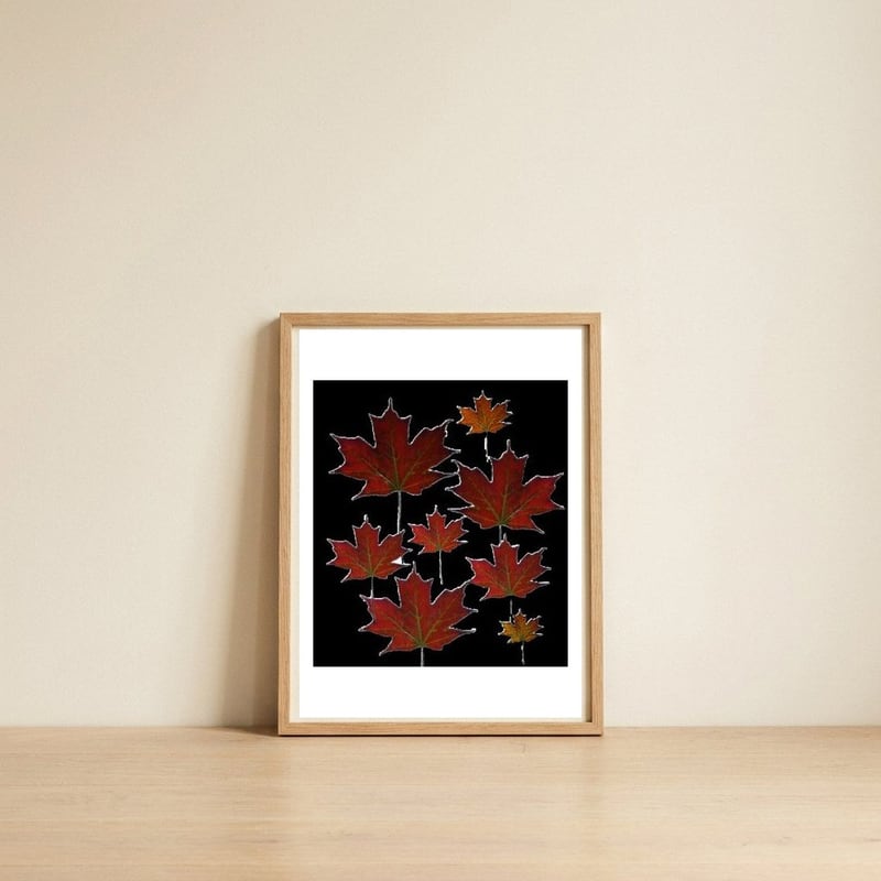 Red Autumn Leaves on Black Ground. — framed, leaning against the wall