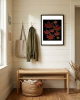 Red Autumn Leaves on Black Ground. framed in a relaxed room thumbnail