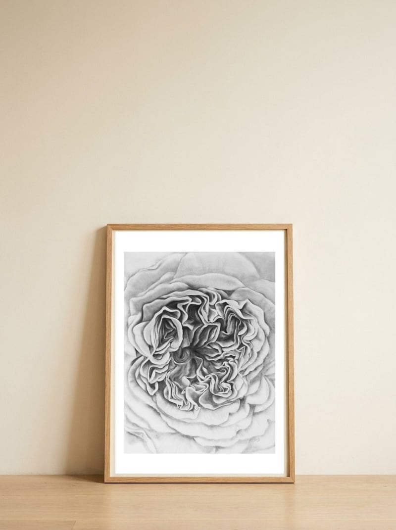 A Rose in Monochrome — framed, leaning against the wall
